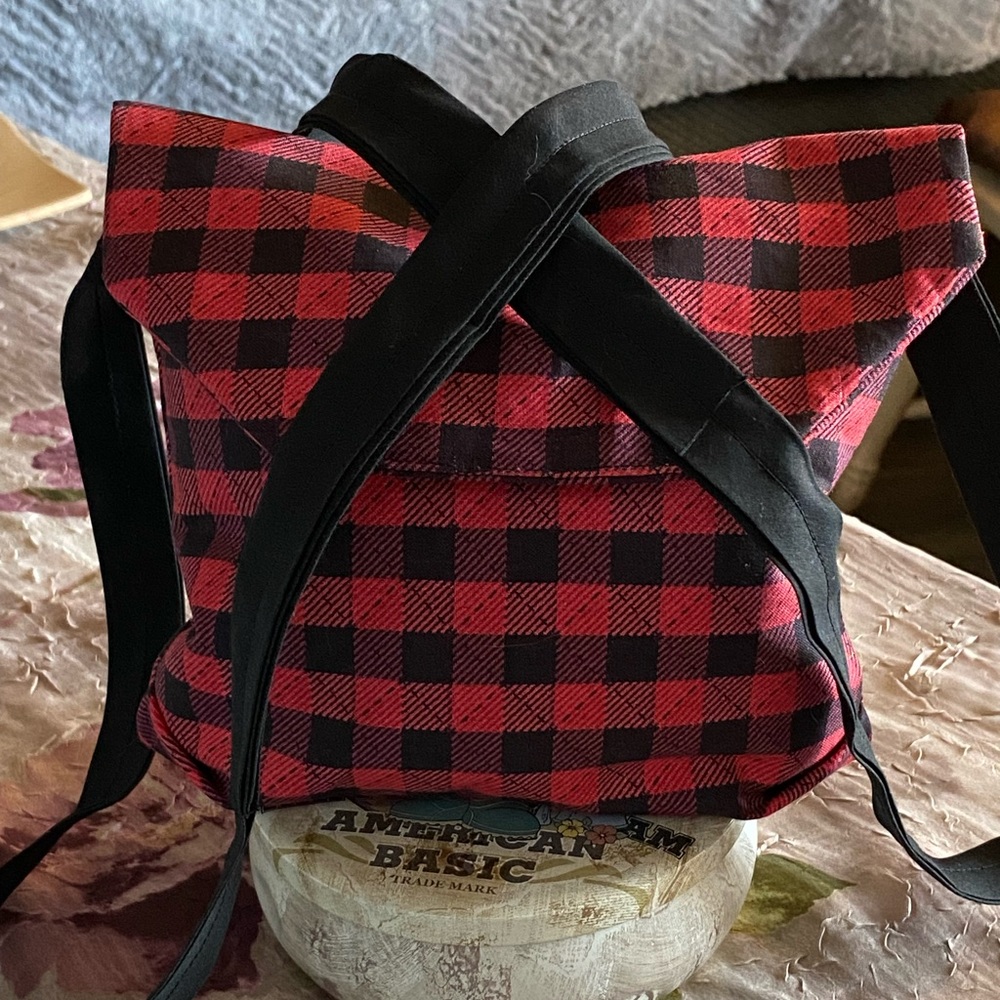 Red and black over the shoulder bag.